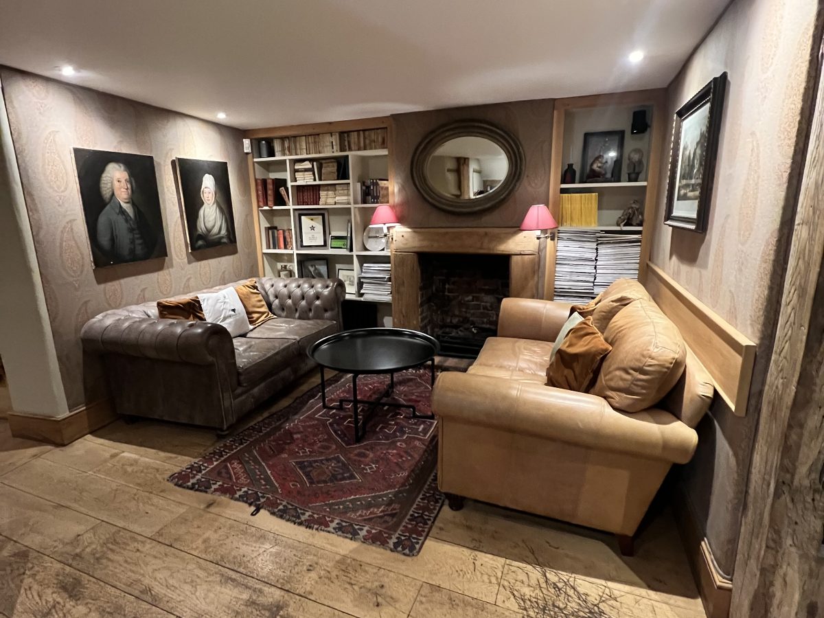 Lounge area with fireplace at The Bell Ramsbury